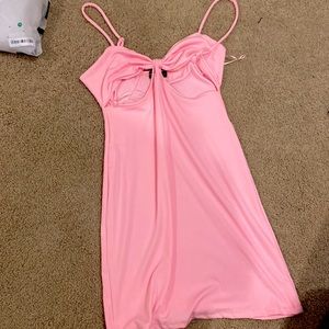baby pink dress long. open at the top where ribs are located